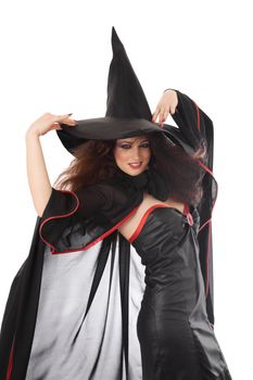 Beautiful young witch for Halloween over white