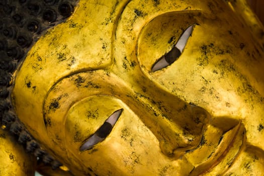 Closeup of the face of a Buddha statue