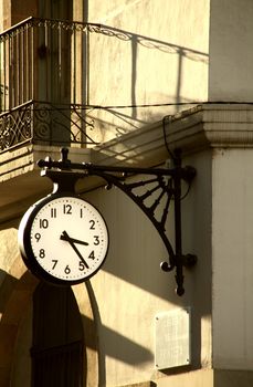 a street clock at the afternoon, time to lunch or to date