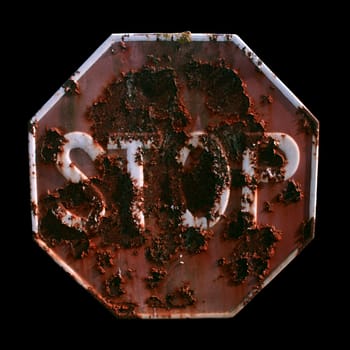 A rusty STOP signal isolated on black

