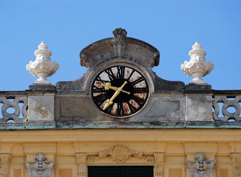 Golden clock fingers at schonbrunn vienna