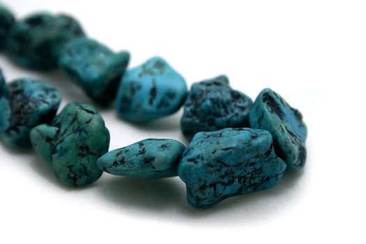 Turquoise stones on white background.