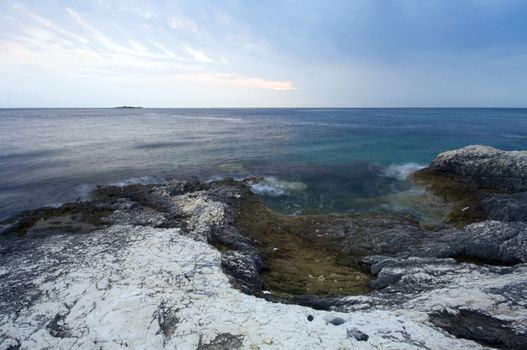 Sea shore with cloudy sky