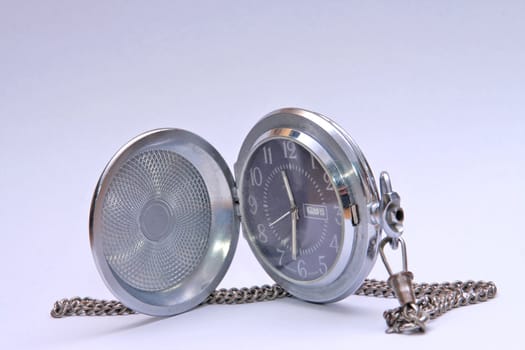 Pocket watch on white surface