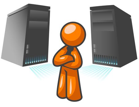An orange man standing confident in front of two large computer servers. 