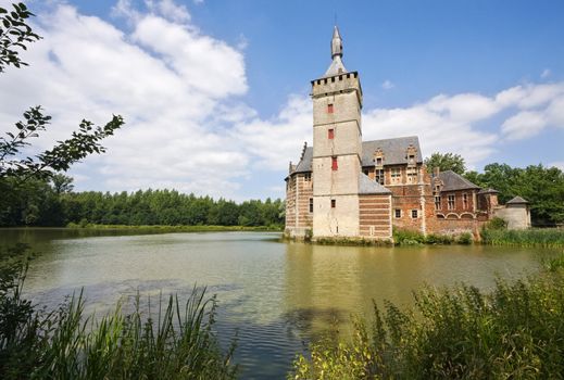 View at castle Horst in Belgium surrounded by pond and woods