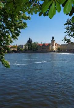 View on embankment of Old city and part of Charles bridge in Prague.