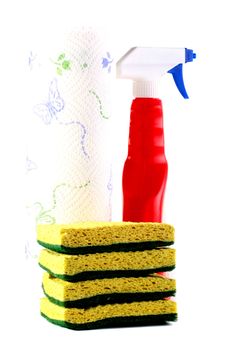 Set for cleaning at office or houses: sponges, a plastic bottle with a spray and paper towels.