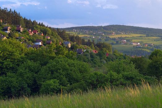 View on the small village located on hills.
