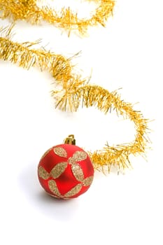 One red christmas balls with gold tinsel
