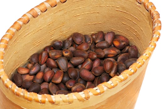 Close-up a pile of cedar nut on basket