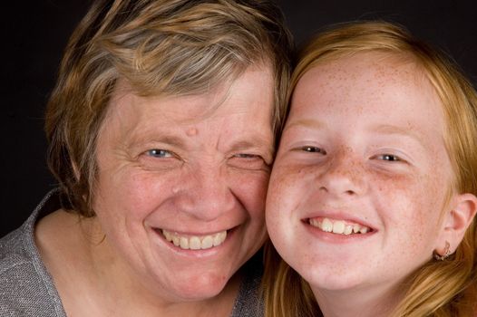 grandmother and granddaughter smiling