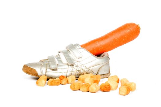 Shoe with carrot for the horse from Sinterklaas on white