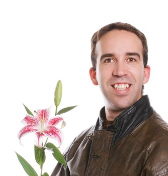 A young man wearing a brown leather jacket and holding a lily flower, isolated against a white background
