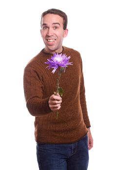 A young guy is holding a large flower, isolated against a white background