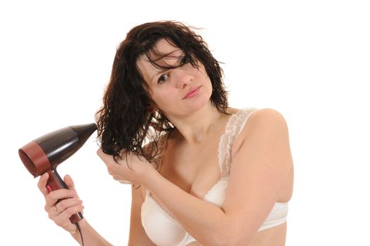 The woman dries the hair dryer hair