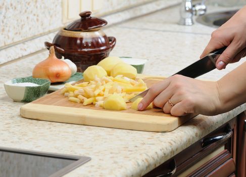 Meal preparation on kitchen from a potato