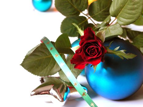 Rose, baubles, star and ribbon on white background