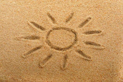 Children's drawing of the sun on sand