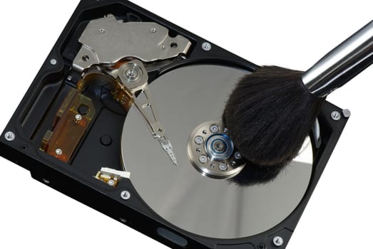 Macro of opened hard disc with cosmetic brush