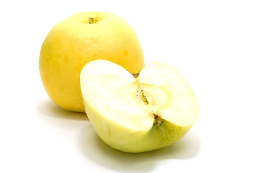 Yellow Apple with Half of Apple Isolated on White Background with Shadow