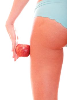 Perfect female figure and red apple