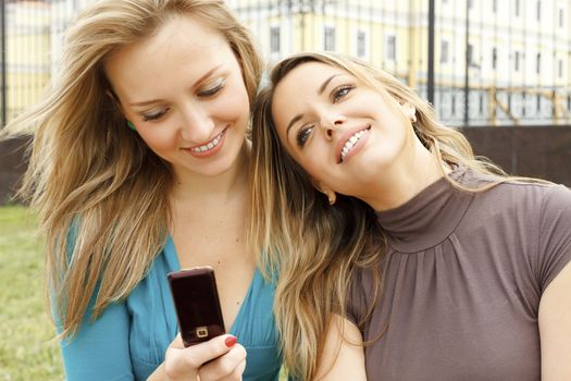 young beautiful girls with mobile phone