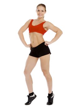 Smiling young sporty muscular woman. Isolated over white background.