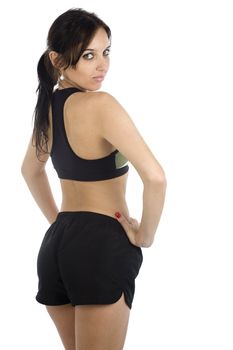 A sexy young hispanic woman wearing a gym outfit, isolated on a white background.