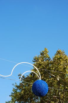 beautiful christmas spirit with blue balls on a local street