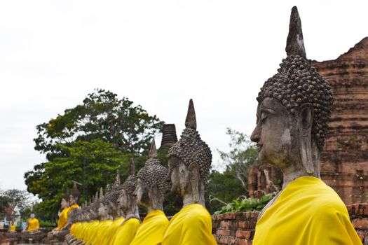 Row of Sacred Buddha images in Ayutthaya, Thailand