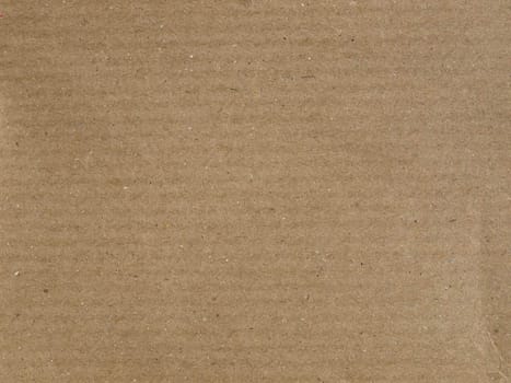 Brown corrugated cardboard sheet useful as a background