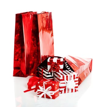 Christmas gifts and shopping bags isolated on white background