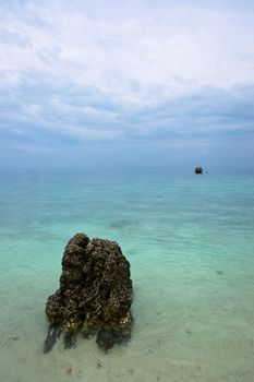 Single boat in endless blue sea