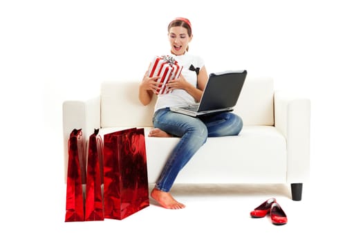 Beautiful young woman at home doing online shop, Consumerism concept
