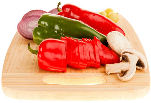 Close-up of various vegetables on wooden board, isloated on white