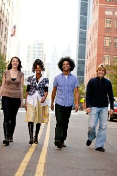 A group of young adults in the city on a street