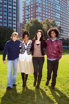 A group of university students infront of a large building