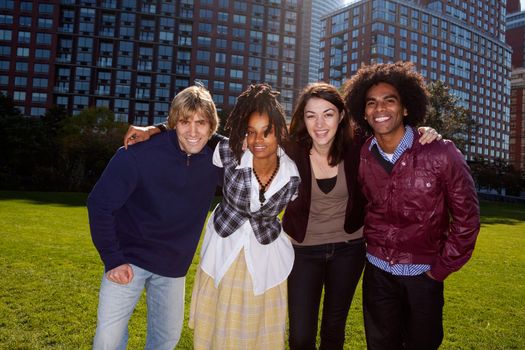 A group of people in front of an apartment building taken into the sun with solar flare