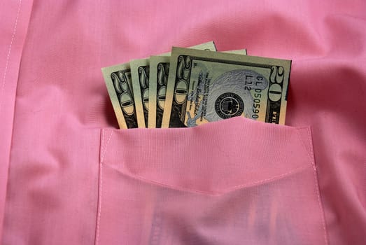  pictures of several twenty dollar bills in the pocket of a shirt