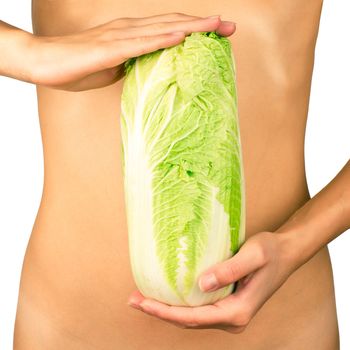 Cabbage in the hands on the background of slim female body