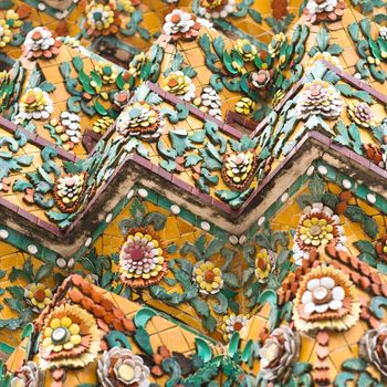 Flower mosaic on the buddhist stupa in Wat Pho Temple, Bangkok, Thailand