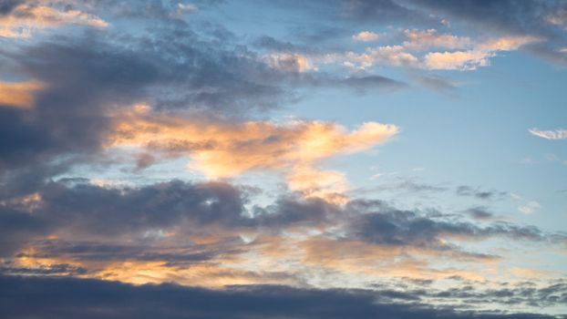 Orange clouds in the sky at sunset