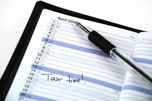 daily planner with an appointment for doing taxes