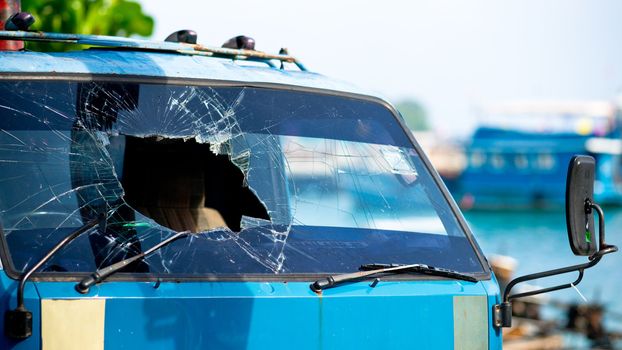 Big hole in cracked windscreen after accident