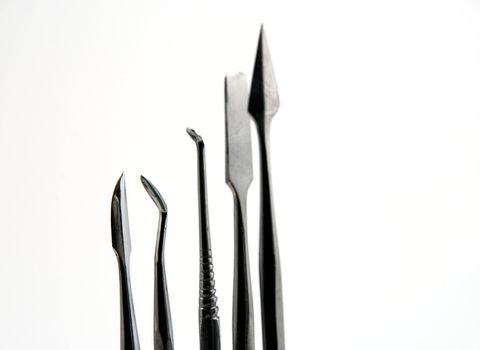 Stock pictures of metal dental instruments used to work on patients