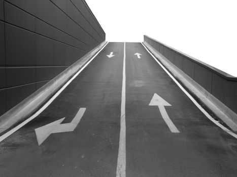 Garage access ramp with two lanes with arrow signs