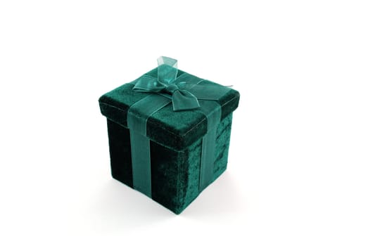 Green gift box with a laced up bow