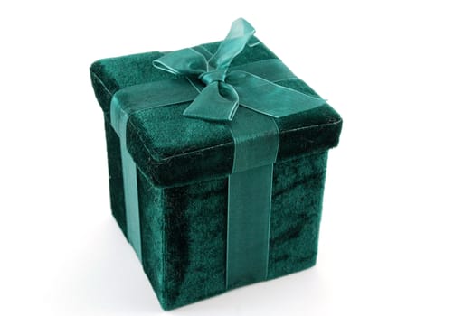 Green gift box with a laced up bow