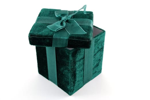 Green gift box with a laced up bow